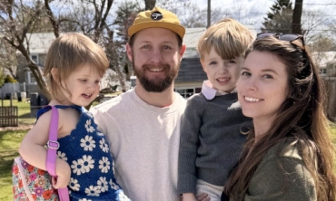 Colin Gleason '11, assistant professor of physics and astronomy, with his wife, Ellen, and their two children, Henry and Charlotte.