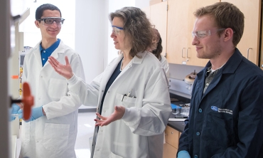 Mary Carroll '86, the Dwane W. Crichton Professor of Chemistry, works with Chris Avanessian '21 and Thomas Andre '20 (right).