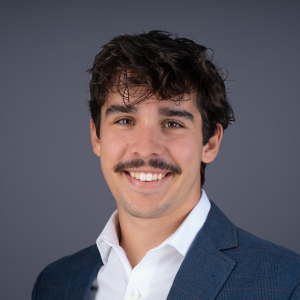 Professional headshot of Theo Goldman